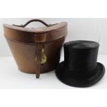 AN 'R.W. FORSYTH' GLASGOW & EDINBURGH SILK TOP HAT, in leather hat case, crimson silk lined (