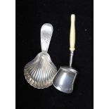 A GEORGE III SILVER CADDY SPOON, scallop bowl and bright cut handle, London 1793, by either