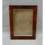 ELEANOR NICHOLAS A HAND STITCHED NEEDLEWORK SAMPLER, typically containing letters and numerals,