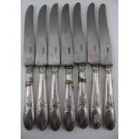 A SET OF SEVEN LATE 19TH CENTURY FRENCH DINNER KNIVES, plated acanthus leaf moulded handles, the