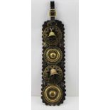 A VICTORIAN MARTINGALE STRAP with two brass bells and two brass bullseyes, 39cm x 10cm
