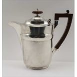THOMAS DUCROW & SONS A SILVER LIDDED JUG, with hinged cover, composition handle, and lid knop,