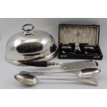 TWO SILVER PLATED BASTING SPOONS, a plated dish dome, plated crumb scoop with horn handle, and a