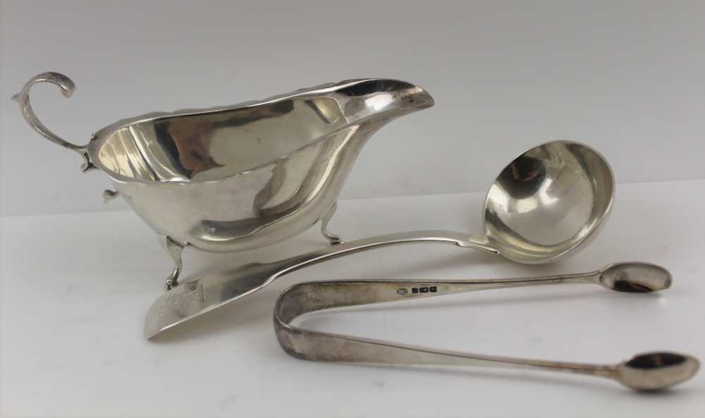 CHARLES BOYTON A VICTORIAN SILVER SAUCE LADLE, fiddle pattern, London 1847, with engraved heraldic