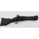 A 19TH CENTURY EASTERN WALL PIECE SMALL FLINTLOCK BLUNDERBUSS, the wood stock with decorative