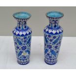 A PAIR OF FAIENCE GLAZED TERRACOTTA VASES in the Iznik style, decorated with stylised fish and