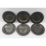 A COLLECTION OF SIX SMALL PEWTER PLATES, four of them with 'London' touch marks, 10cm in diameter