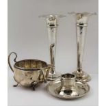 TWO EDWARDIAN SILVER TRUMPET FORM BUD VASES of tapering form, on loaded bases, both Birmingham 1903,