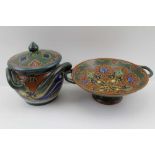 TWO PIECES OF GOUDA RHODIAN POTTERY, hand-painted in bold palette designs, comprising a lidded pot