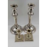 A PAIR OF VICTORIAN SILVER ON COPPER CANDLESTICKS having gadrooned rims, on circular platform bases,