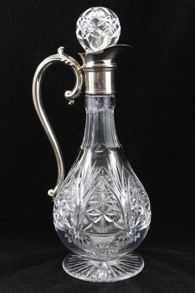 A CUT GLASS CLARET JUG with plated collar and handle, raised on circular star cut base, 30cm high, - Image 2 of 4