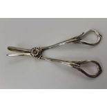A PAIR OF VICTORIAN DESIGN SILVER GRAPE SCISSORS, aesthetic flowerhead and frond decoration,