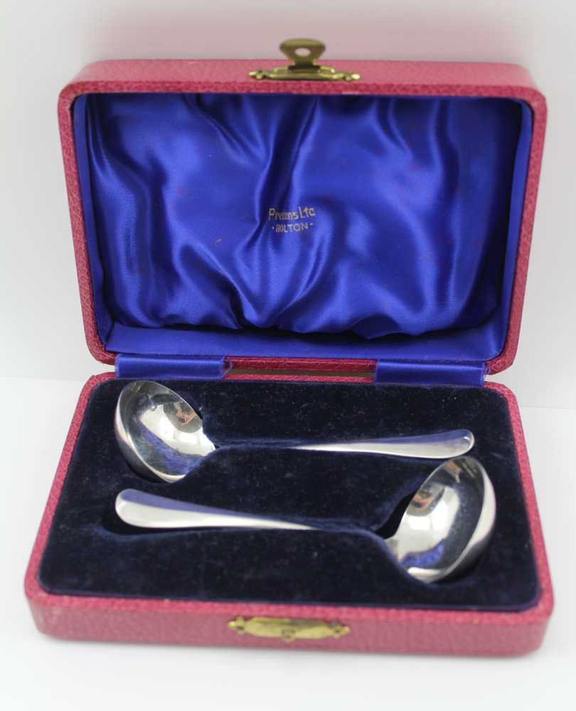 COOPER BROTHERS & SONS LTD A PAIR OF SILVER SAUCE LADLES of rat tail design, Sheffield 1933 / 34,