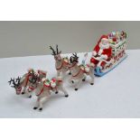 A VILLEROY & BOCH PORCELAIN TABLE CENTRE PIECE, of Santa on his present laden sleigh, pulled by