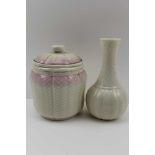A ' BELLEEK' CERAMIC JAR & COVER, pink blush coloured, removable cover with floral knop, 14cm high