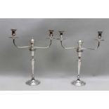 A PAIR OF 19TH CENTURY OLD SHEFFIELD PLATE CANDELABRA, comprising a pair of candlesticks, with