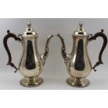 NAYLER BROTHERS A PAIR OF GEORGIAN DESIGN SILVER COFFEE POTS, of baluster form, the domed, hinged
