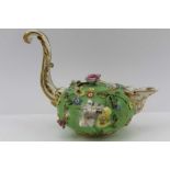 AN EARLY 19TH CENTURY DERBY LIDDED CERAMIC JUG, of squat floral encrusted form, with cover having