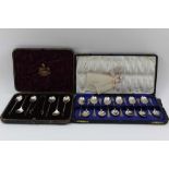 JAMES SWANN & SON A CASED SET OF TWELVE SILVER TEASPOONS, with scallop shell terminals and barley