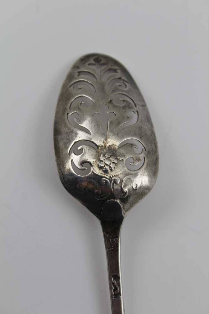 AN 18TH CENTURY SILVER MOTE SPOON, flower and scroll decoration to the reverse of the bowl, possibly - Image 3 of 4