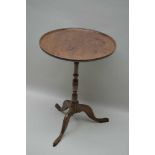 A 19TH CENTURY MAHOGANY CIRCULAR SAUCER TOPPED TABLE on slender turned column and three downswept