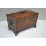 A 19TH CENTURY MAHOGANY SARGOPHAGUS FORM TEA CADDY, the cover opens to reveal twin lidded containers