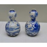 A PAIR OF JAPANESE PORCELAIN VASES of double gourd form, with reticulated bases, decorated with