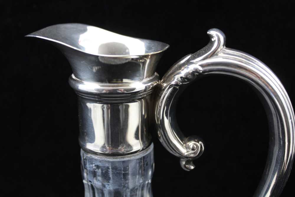 A CUT GLASS CLARET JUG with plated collar and handle, raised on circular star cut base, 30cm high, - Image 4 of 4