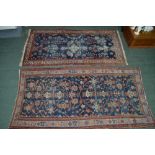 AN EARLY TO MID 20TH CENTURY BLUE GROUND PERSIAN RUG, stylised designs to the central designs to the