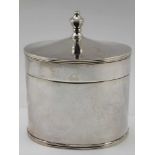 GUILD OF HANDICRAFT AN OVAL SILVER TABLE BOX, urn finial handle to the cover, plain Georgian form,
