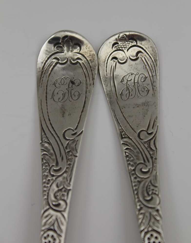 TWO GEORGE III SILVER BERRY SPOONS, repousse and chased decoration, London 1807 and 1817, combined - Image 3 of 4