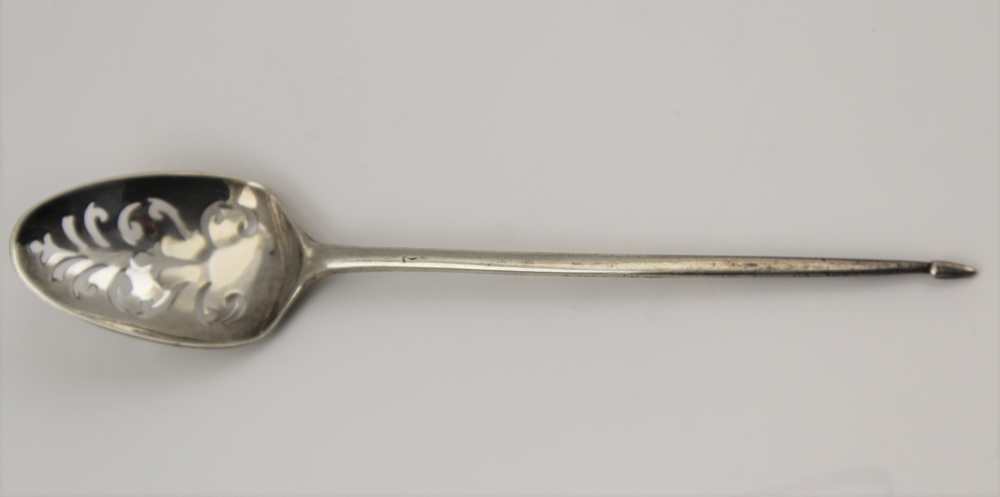 AN 18TH CENTURY SILVER MOTE SPOON, flower and scroll decoration to the reverse of the bowl, possibly