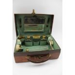 AN EARLY 20TH CENTURY LADY'S VANITY CASE, crocodile effect leather, the fitted interior with gilt