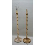 TWO FIRST QUARTER 20TH CENTURY BELIEVED TERRACOTTA PAINTED FLOOR STANDING LAMPS (a near pair) each