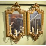 A PAIR OF 19TH CENTURY GILT GESSO FRAMED PLAIN PLATE WALL MIRRORS, each having three sconce candle