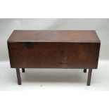 A GEORGE III MAHOGANY SQUARE DROP LEAF TABLE on squared supports, 121cm