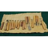 A ROLL OF WOOD CARVERS CHISELS, various shapes, tips and widths, various wood handles (20)