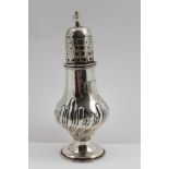NATHAN & HAYES A GEORGIAN DESIGN SILVER SUGAR CASTER, urn finial, baluster form with repousse base