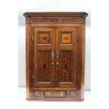 A 19TH CENTURY OAK BODIED HANGING CORNER CUPBOARD, with mahogany bound and lozenge inlaid panelled