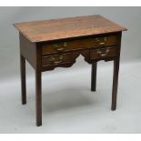AN EARLY 19TH CENTURY OAK LOWBOY having plain rectangular top, over single full width drawer and two