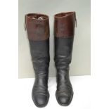 A PAIR OF TAN TOP BLACK HUNTING BOOTS with aluminium trees