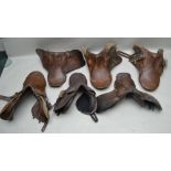 A COLLECTION OF FIVE HUNTING/GENERAL PURPOSE SADDLES various sizes from 17" to 18" and one later