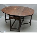 A LATE 18TH / EARLY 19TH CENTURY OAK OVAL TOPPED TWIN FLAPPED GATELEG TABLE, fitted with a single