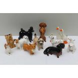 A SELECTION OF SMALL SIZED PORCELAIN ANIMALS, the majority Beswick dogs, to include a high gloss,