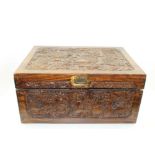 AN EARLY 20TH CENTURY CARVED WOOD BOX, carved with dragon decoration to the lid, and carved panels