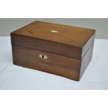 A LATE 19TH CENTURY ROSEWOOD SEWING BOX, the hinged lid opening to reveal a tray and various