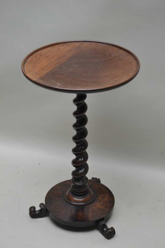 A 19TH CENTURY MAHOGANY CIRCULAR SAUCER TOPPED TABLE on barley twist column, circular plinth base