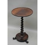 A 19TH CENTURY MAHOGANY CIRCULAR SAUCER TOPPED TABLE on barley twist column, circular plinth base