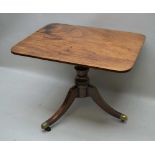 A 19TH CENTURY MAHOGANY SNAP-TOP BREAKFAST TABLE, raised on turned stem with three outswept supports