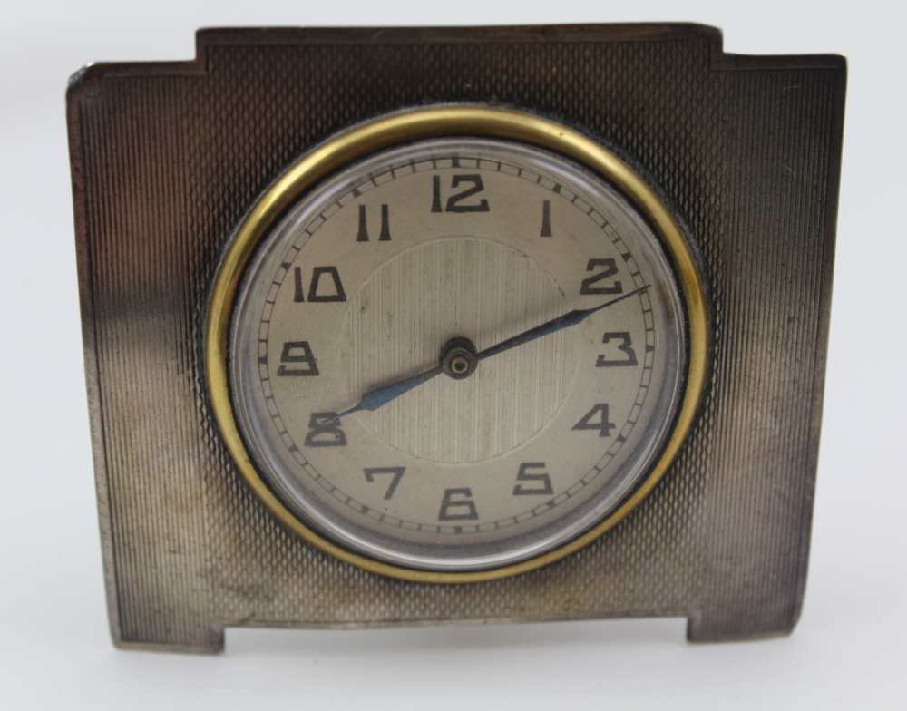 F.H. ADAMS & CO. AN ART DECO TRAVEL CLOCK, engine turned case, the dial with Arabic numerals, - Image 6 of 9